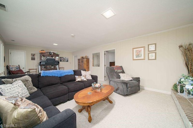 carpeted living room with ornamental molding