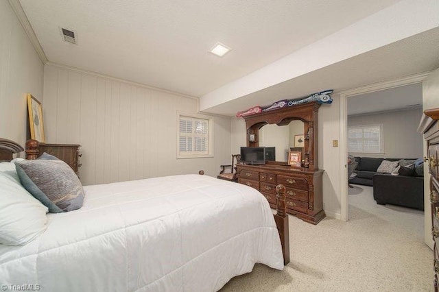 carpeted bedroom featuring ornamental molding