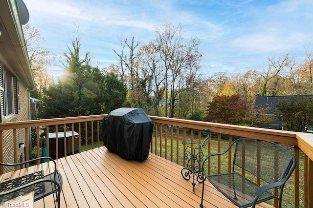 deck featuring a grill