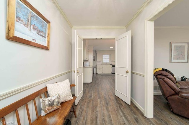 hall with dark hardwood / wood-style flooring and ornamental molding