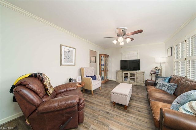 living room featuring hardwood / wood-style flooring, ornamental molding, and ceiling fan