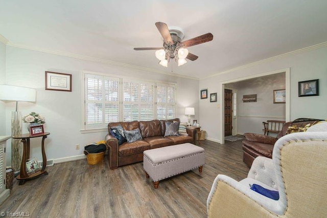 living room with ceiling fan, dark hardwood / wood-style floors, and crown molding