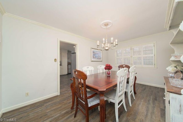 dining space with dark wood-type flooring, crown molding, and a chandelier