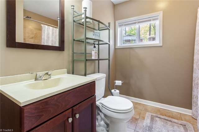 bathroom featuring a shower with curtain, toilet, baseboards, tile patterned flooring, and vanity