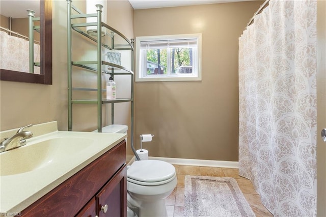 full bathroom featuring tile patterned floors, toilet, vanity, baseboards, and a shower with shower curtain