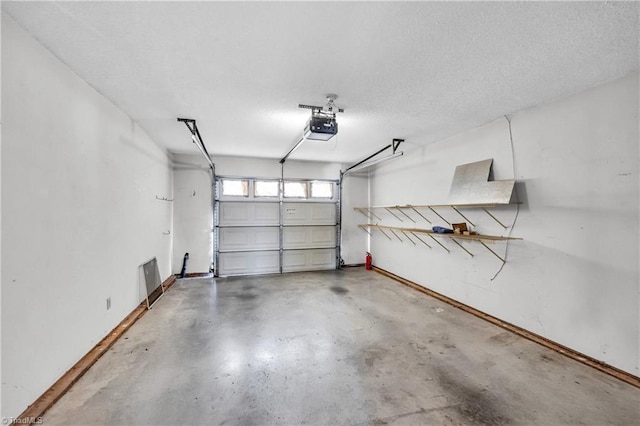 garage featuring baseboards and a garage door opener