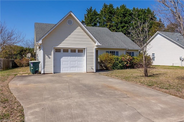 ranch-style house with a front yard, an attached garage, driveway, and roof with shingles