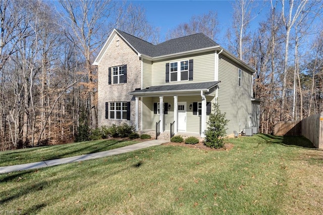 view of property with a front yard and central air condition unit