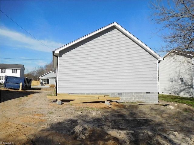 view of home's exterior with crawl space