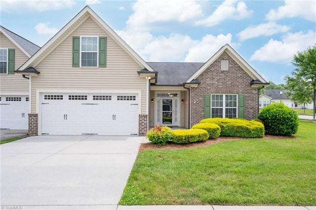 6924 Langdon Village Ct, Clemmons, NC 27012 - view of front facade featuring brick siding, concrete driveway, a front yard, and a garage