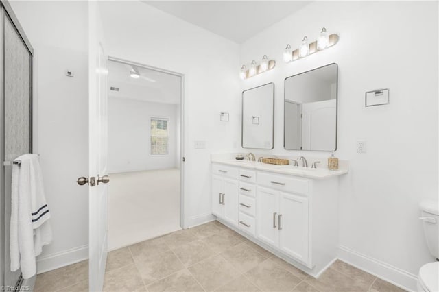 6924 Langdon Village Ct, Clemmons, NC 27012 - bathroom featuring double vanity, tile patterned floors, and a ceiling fan
