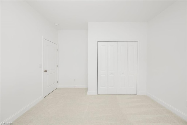 6924 Langdon Village Ct, Clemmons, NC 27012 - unfurnished bedroom with light colored carpet and a closet