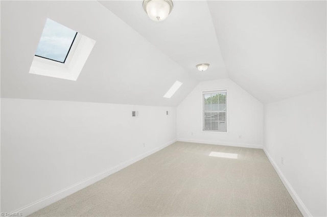 6924 Langdon Village Ct, Clemmons, NC 27012 - bonus room featuring a skylight, lofted ceiling, and light colored carpet