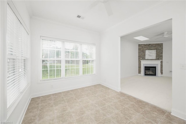 6924 Langdon Village Ct, Clemmons, NC 27012 - unfurnished living room featuring ceiling fan, crown molding, and a fireplace