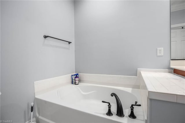 bathroom featuring vanity and a bathtub