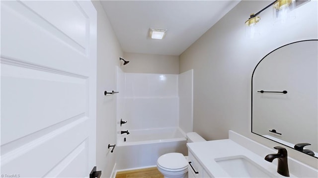 full bathroom featuring shower / tub combination, vanity, and toilet