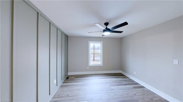 unfurnished bedroom featuring ceiling fan and light hardwood / wood-style flooring