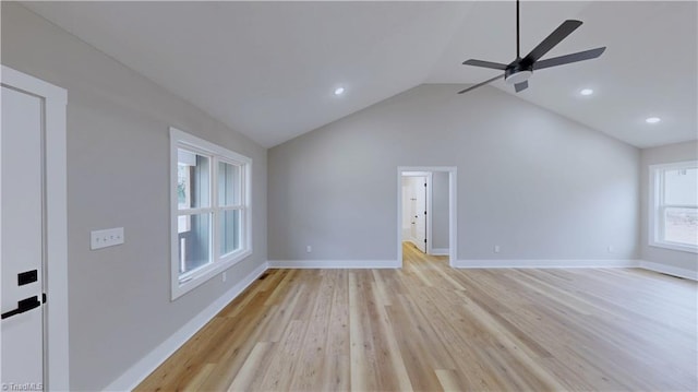 unfurnished living room with lofted ceiling, ceiling fan, and light wood-type flooring