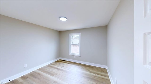 spare room with light hardwood / wood-style floors