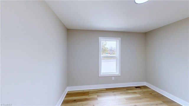 unfurnished room with light hardwood / wood-style floors