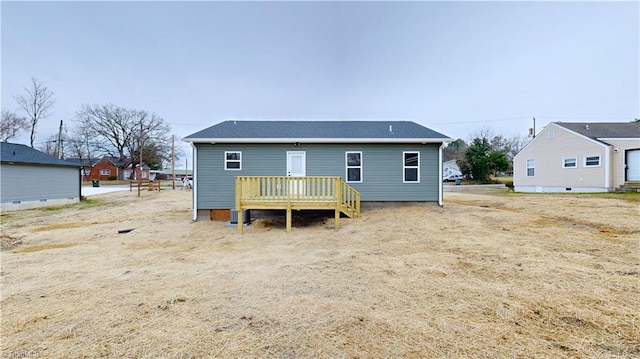 back of property featuring a deck