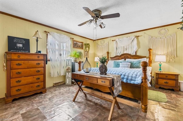 bedroom featuring ceiling fan, ornamental molding, and a textured ceiling