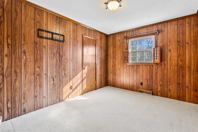 empty room with wooden walls and carpet