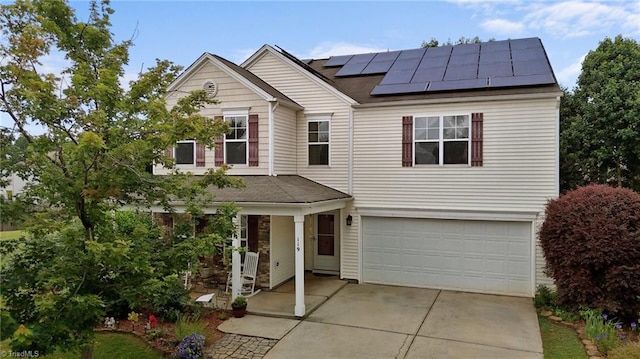119 Tadworth Ct, Mebane, NC 27302 - traditional-style house with roof mounted solar panels, a garage, driveway, and roof with shingles