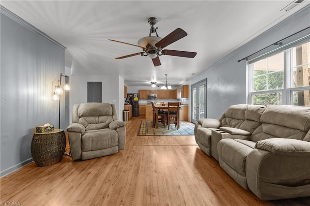 119 Tadworth Ct, Mebane, NC 27302 - living area with light wood finished floors, ceiling fan, and crown molding