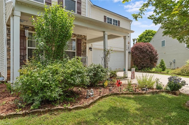 119 Tadworth Ct, Mebane, NC 27302 - view of home's exterior featuring concrete driveway, an attached garage, a yard, and stone siding