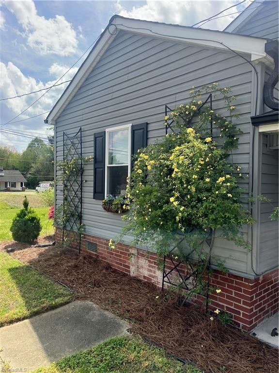 view of side of property with crawl space
