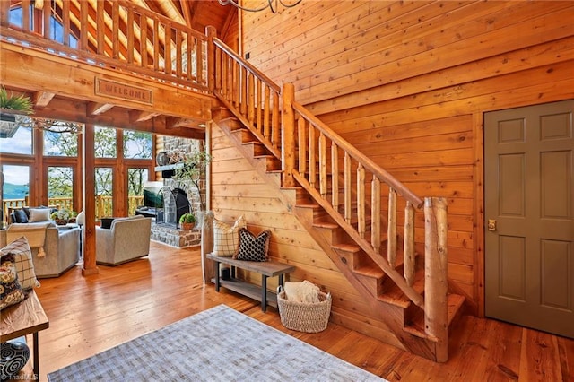 324 Sugar View Trl, Banner Elk, NC 28604 - stairs with a towering ceiling, wood walls, and wood-type flooring