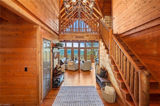324 Sugar View Trl, Banner Elk, NC 28604 - entryway with a chandelier, wood walls, french doors, stairway, and wood finished floors