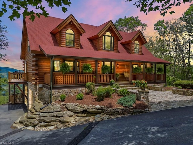 324 Sugar View Trl, Banner Elk, NC 28604 - view of front of home featuring a porch, log exterior, and driveway
