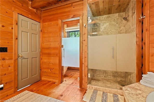 324 Sugar View Trl, Banner Elk, NC 28604 - full bathroom featuring a shower stall, wood-type flooring, wooden walls, and wooden ceiling