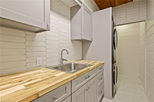 324 Sugar View Trl, Banner Elk, NC 28604 - kitchen featuring wood counters, stacked washing machine and dryer, tasteful backsplash, and wooden ceiling