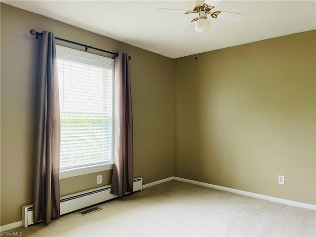 empty room with baseboards, light colored carpet, and plenty of natural light