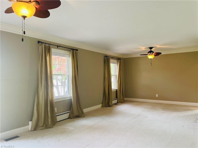 spare room featuring ornamental molding, a ceiling fan, visible vents, and light colored carpet