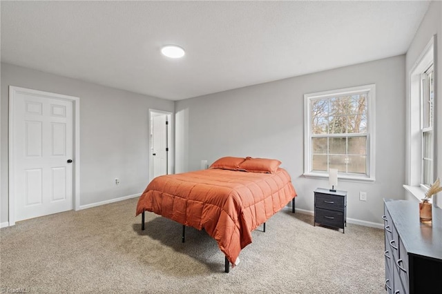 bedroom with light colored carpet