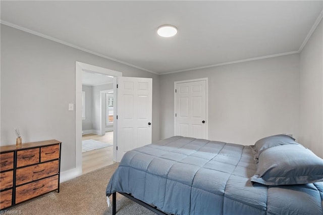 bedroom featuring ornamental molding and carpet floors