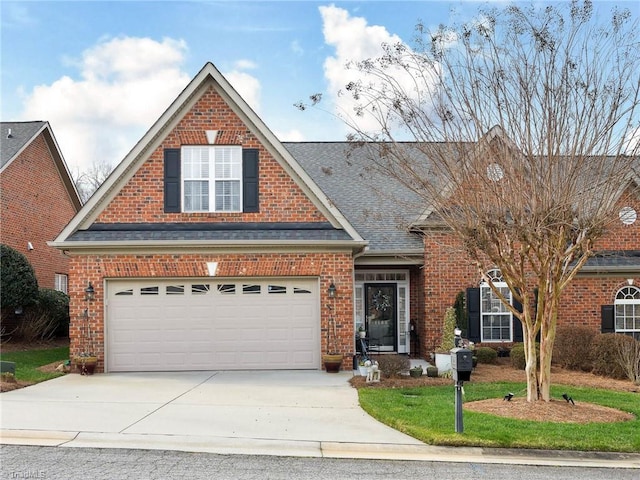 traditional home featuring brick siding, driveway, and a garage