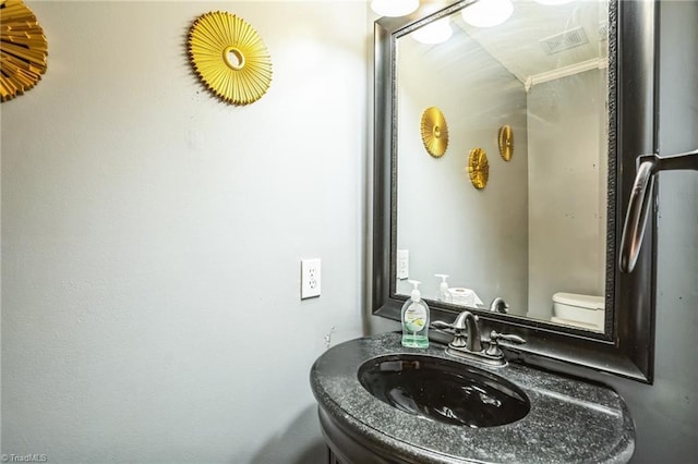 bathroom featuring sink and toilet