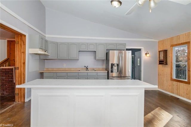 kitchen featuring dark hardwood / wood-style floors, sink, gray cabinetry, lofted ceiling, and stainless steel fridge with ice dispenser