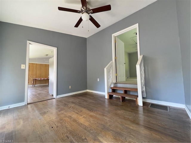 empty room featuring ceiling fan and hardwood / wood-style floors