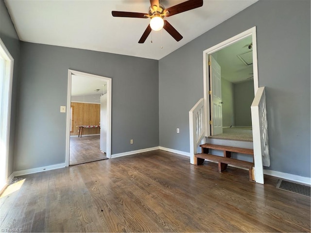 unfurnished bedroom with ceiling fan, vaulted ceiling, and hardwood / wood-style flooring