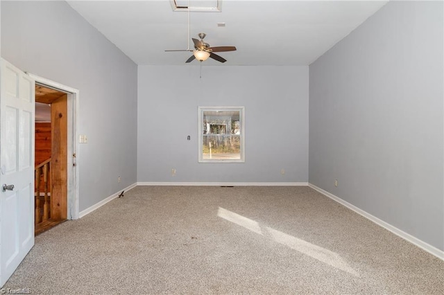 carpeted spare room with ceiling fan