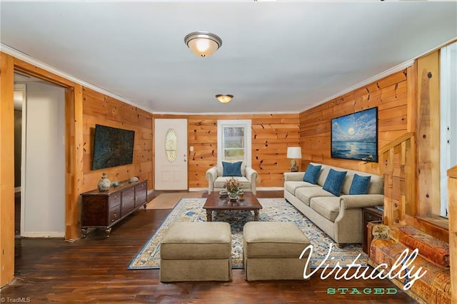 living room featuring wood walls, dark wood-type flooring, and ornamental molding