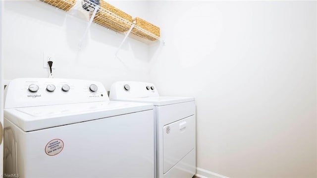 washroom featuring washing machine and clothes dryer