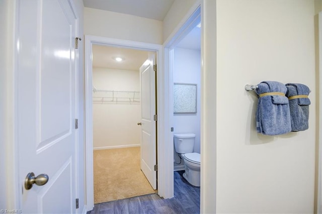 bathroom featuring toilet and hardwood / wood-style flooring