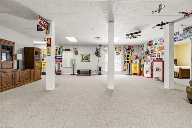 basement featuring a paneled ceiling